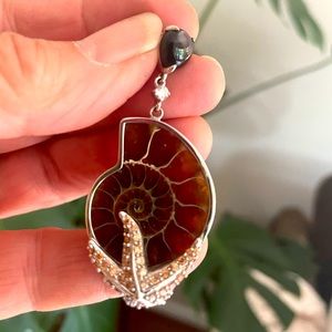 Silver encased ammonite embraced by Silver and citrine starfish sapphire toggle